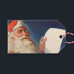 Vintage Christmas, Santa Claus いけな Nice List ギフトタグ<br><div class="desc">簡単メッセージを作成するためにクリスマスギフトタグをパーソナライズするカスタムために。ヴィンテージイラストレーションメリークリスマスの休日の画像すてきは、サンタクロースが赤い帽子を被り、クリスマスイブに彼のいけなまたは素敵なリストをチェックする。</div>