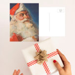 Vintage Christmas, Santa Claus いけな Nice List シーズンポストカード<br><div class="desc">ヴィンテージイラストレーションメリークリスマスの休日の画像すてきは、サンタクロースが赤い帽子を被り、クリスマスイブに彼のいけなまたは素敵なリストをチェックする。</div>