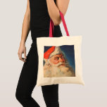 Vintage Christmas, Santa Claus いけな Nice List トートバッグ<br><div class="desc">ヴィンテージイラストレーションメリークリスマスの休日の画像すてきは、サンタクロースが赤い帽子を被り、クリスマスイブに彼のいけなまたは素敵なリストをチェックする。</div>