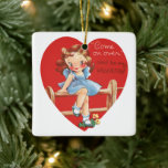 Vintage Cute Valentine's Day, Girl on a Fence セラミックオーナメント<br><div class="desc">Vintage illustration Valentine's Day holiday design featuring a cute young girl dressed in a blue dress sitting on a fence. There is a large red heart behind her. "Come on Over and Be My Valentine"</div>