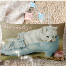 Vintage cute white kitten in a blue satin shoe