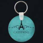 Vintage French Flourish Keychain, Teal キーホルダー<br><div class="desc">Grungy yet elegant Vintage French Flourish Keychain in teal featuring an Eiffel Tower design embellished with chic swirls and dots and a faux paper textured background. This unique Parisian themed key fob will adds a funky French flair to keeping your keys handy! Easy to customize, simply add the personalized text...</div>