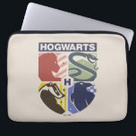 Vintage HOGWARTS™ Stamped Crest ラップトップスリーブ<br><div class="desc">Show your house pride in bold, vintage-inspired style with this striking Hogwarts™ crest design. Featuring graphic silhouettes representing the four iconic houses — Gryffindor™, Slytherin™, Hufflepuff™, and Ravenclaw™ — this artwork blends classic symbolism with a modern, retro aesthetic. Each house emblem is set within a clean, color-blocked shield, creating a...</div>