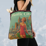 Vintage Travel, Atlantic City Resort Beach Blonde トートバッグ<br><div class="desc">Vintage illustration United States of America travel poster or luggage label for Atlantic City, New Jersey via the Pennsylvania railroad featuring a beautiful blond pin up woman in a bathing suit holding a towel looking up at the sun on the beach during the summer. People are having fun on the...</div>
