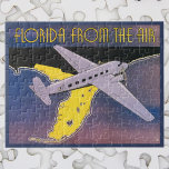 Vintage Travel Poster, Florida from Air Airplane ジグソーパズル<br><div class="desc">ヴィンテージイラストレーションアメリカ合衆国フロリダからの旅行ポスターまたは荷物ラベルは、フロリダの海岸線の州上の空のプロペラの飛行機飛んでいる、海と有名なビーチを特集。フロリダだ！</div>