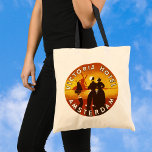 Vintage Travel, Victoria Hotel, Amsterdam, Holland トートバッグ<br><div class="desc">Vintage illustration European travel poster or luggage label from the Victoria Hotel,  Amsterdam,  Holland (the Netherlands) featuring a man and a woman in traditional dress and wearing clogs. A windmill,  sailboat on the ocean and a yellow sunset are in the background behind a silhouette of a happy couple.</div>