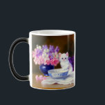 Vintage White Kitten with Purple Ribbon モーフィングマグカップ<br><div class="desc">Magic Mug featuring a beautiful white kitten wearing a purple ribbon! This fluffy kitty poses next to a blue bowl and a vase of pink,  purple,  and white flowers. A marvelous gift for cat lovers and Victorian art enthusiasts!</div>