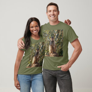 Watchful Sentinel: Meerkat On Lush Green Backdrop Tシャツ
