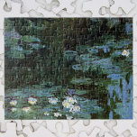 Waterlilies by Claude Monet, Vintage Fine Art ジグソーパズル<br><div class="desc">Waterlilies by Claude Monet is a vintage impressionism fine art nature painting featuring waterlilies in a pond in Monet's garden at his home in Giverny, France. The weeping willow trees cast a reflection in the pond. Claude Monet enjoyed painting "en plein air" or "in the open air." A series of...</div>