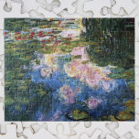 Waterlilies by Claude Monet, Vintage Fine Art ジグソーパズル<br><div class="desc">Waterlilies by Claude Monet is a vintage impressionism fine art nature painting featuring waterlilies in a pond in Monet's garden at his home in Giverny, France. The deep green of the weeping willow trees are casting a reflection in the pond. Claude Monet enjoyed painting "en plein air" or "in the...</div>