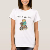 Whimsical Frog Riding A Bike Illustration Tシャツ (正面)