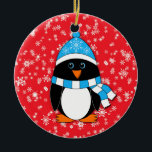 Winter Whimsy Penguin セラミックオーナメント<br><div class="desc">This penguin is dressed in a blue and white winter hat and scarf.  Background is red with white snowflakes.  Back is red with white "Merry Christmas!" text that may be personalized.</div>