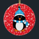 Winter Whimsy Penguin セラミックオーナメント<br><div class="desc">This penguin is dressed in a blue and white winter hat and scarf.  Background is red with white snowflakes.  Back is red with white "Merry Christmas!" text that may be personalized.</div>