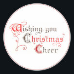 Wishing You Christmas応援ヴィンテージ照明 ラウンドシール<br><div class="desc">精巧なヴィンテージ読文字"Wishing You Christmas応援。 各単語の最初の文字は光書の原稿に似た古いファッションドレタリングで書かれている。赤と黒の文字と緑縁ど。グリーティングカードに一致。</div>