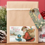 Wishing You Christmas応援by Ellen Clapsaddle 長方形シール<br><div class="desc">ヴィンテージイラストレーションビクトリアンのクリスマスの休日のデザインは、古い世界サンタクロースの若い男の子の横に立つ運おもちゃのバッグのをフィーチャー。</div>