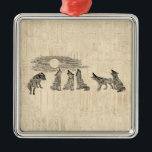 Wolves Howling at the Moon Vintage Wolf Art メタルオーナメント<br><div class="desc">A vintage wolf art design featuring wolves howling at the moon in an old fashioned antique illustration.  With a light beige color classic script paper style background!</div>