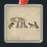 Wolves Howling at the Moon Vintage Wolf Art メタルオーナメント<br><div class="desc">A vintage wolf art design featuring wolves howling at the moon in an old fashioned antique illustration.  With a light beige color classic script paper style background!</div>