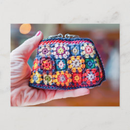 Woman Holding a Crocheted Coin Purse Made From Gra ポストカード