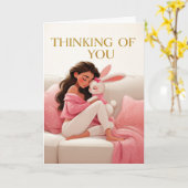 Woman Hugging Bunny on Couch Thinking of You カード (黄色い花)