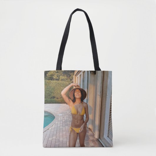 Woman in yellow bikini standing on brown brick flo トートバッグ (正面)