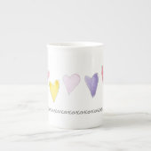 xoxoxoxo水色ピンク黄色のハート小愛 ボーンチャイナマグカップ (正面)