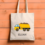 Yellow Dump Truck Kids Personalized Construction トートバッグ<br><div class="desc">This kids' tote bag features an illustration of a yellow dump truck. Personalize it with your child's name in black letters. Makes a great book bag!</div>