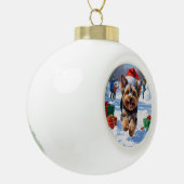 Yorkipoo Running in Snow with Christmas Hat セラミックボールオーナメント (左)
